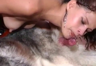 Tanned slut gets licked by a furry dog