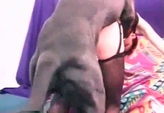 Zoophilic chick enjoys black dog cock