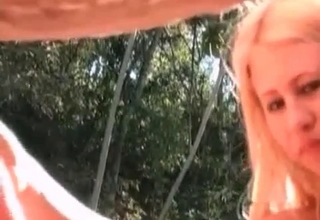 Sexy blonde jerks off a horse dick with love